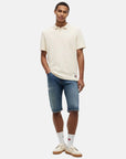 polo-tommy-jeans-blanc-porte