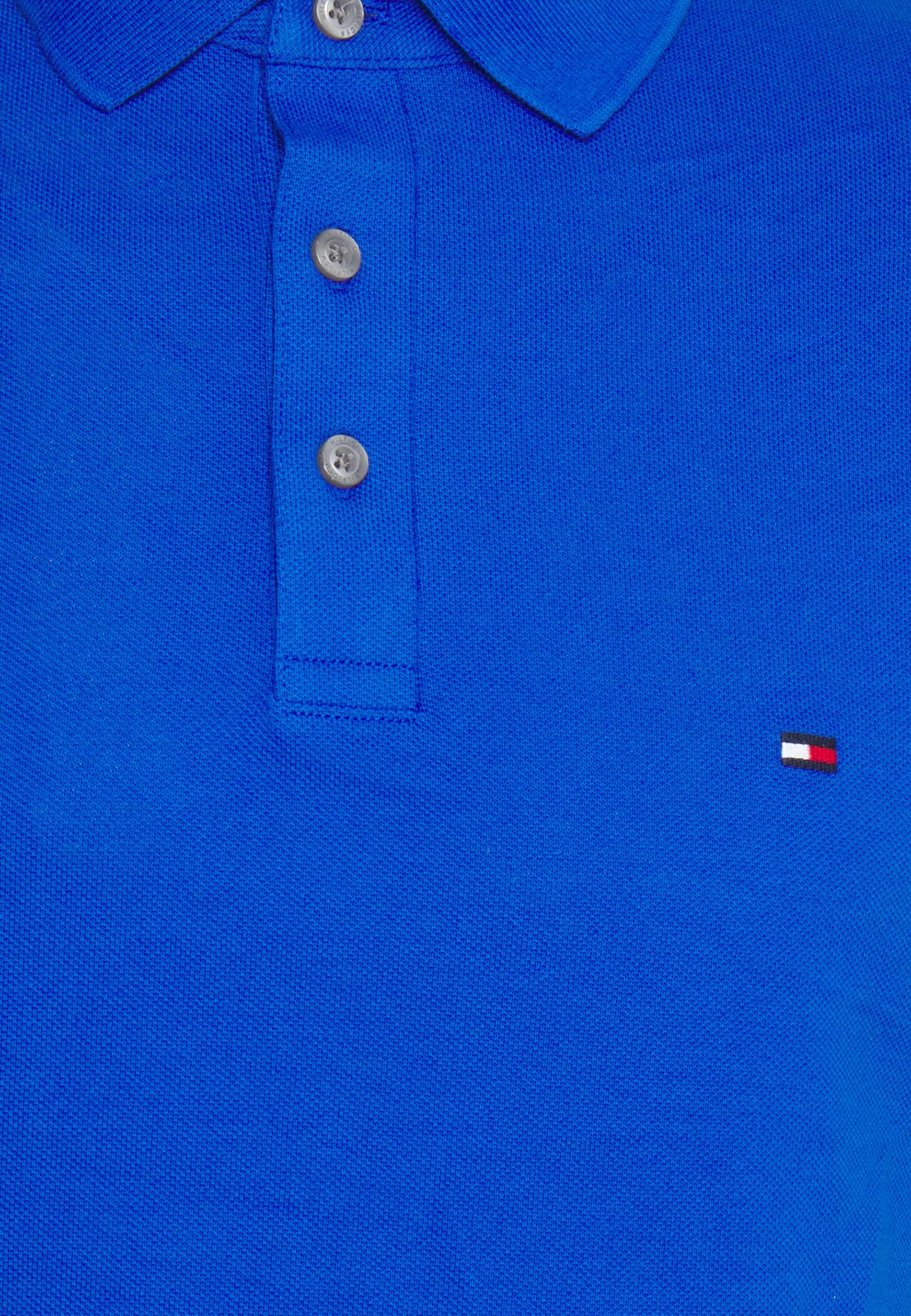 Polo Tommy Hilfiger ajusté bleu en coton bio pour homme I Georgespaul