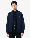 gilet-zippe-lacoste-marine-face-sh8870-00-166