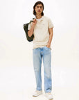 polo-tommy-hilfiger-beige-homme-porte