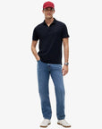polo-tommy-hilfiger-marine-homme-MW0MW35585DW5-porte